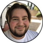 Apollo outside smiling at the camera.